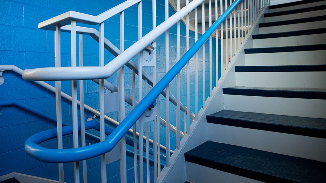 Stairwell in blue, Eastern Mennonite School's color.