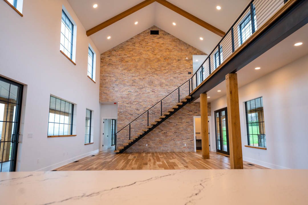 wide of the two-story high interior brick wall hill top house