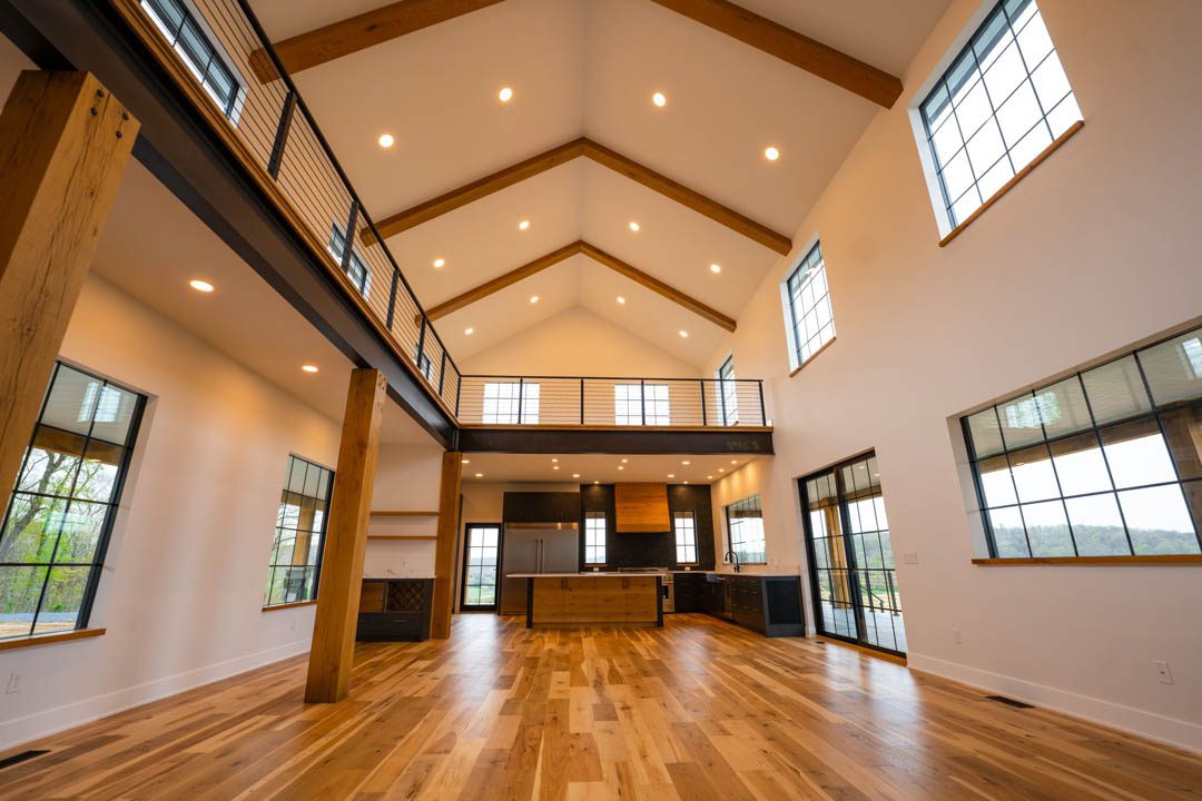 wide-view of open floor plan. kitchen and second floor hill top house