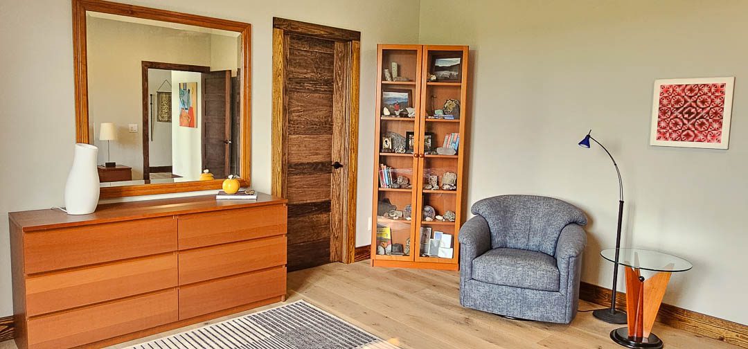 sofa, dresser, and shelves in bedroom