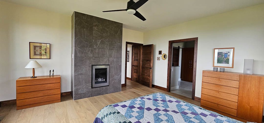 bedroom with electric fireplace