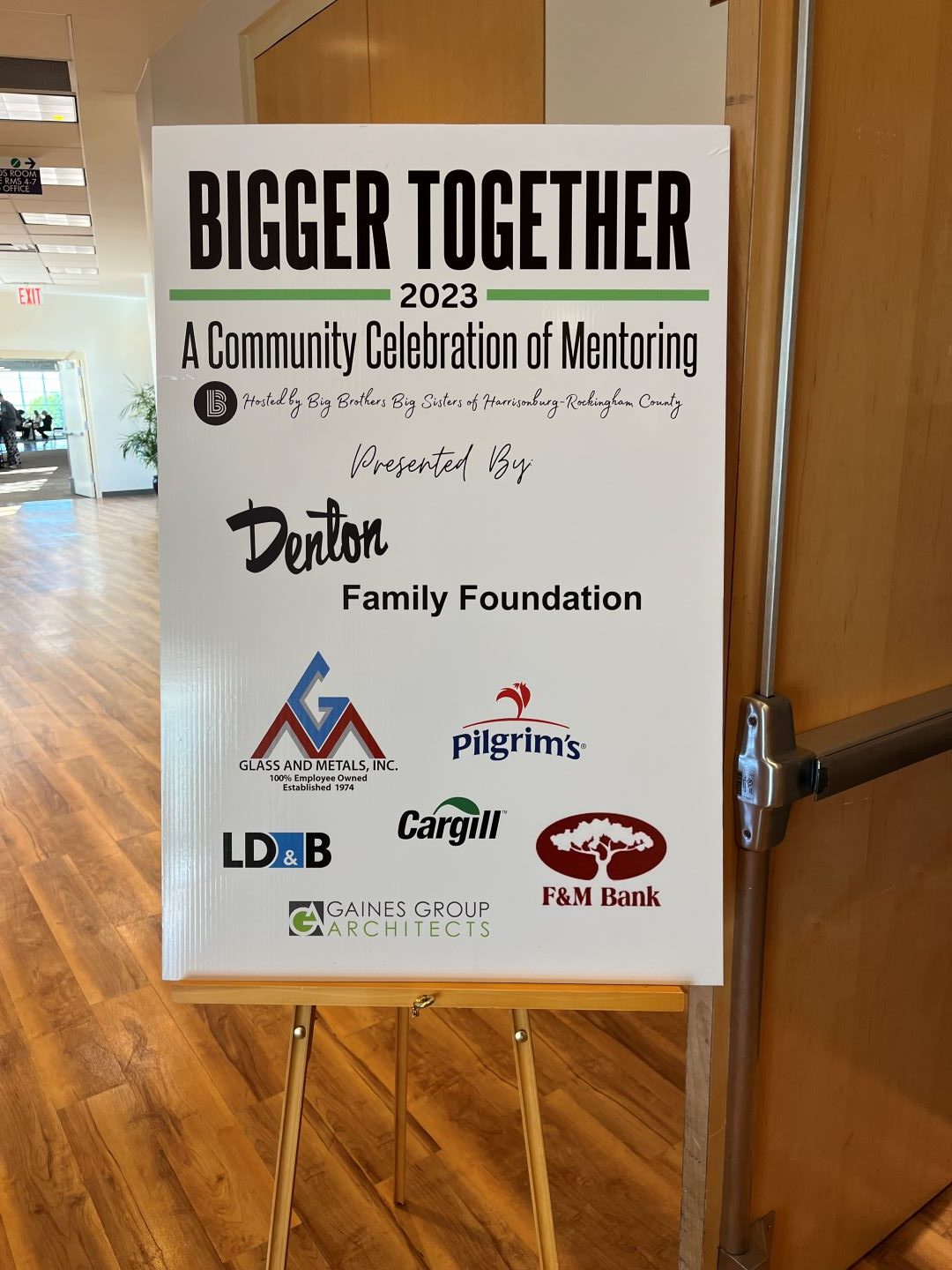 Big Brothers Big Sisters sponsorship sign at the luncheon.